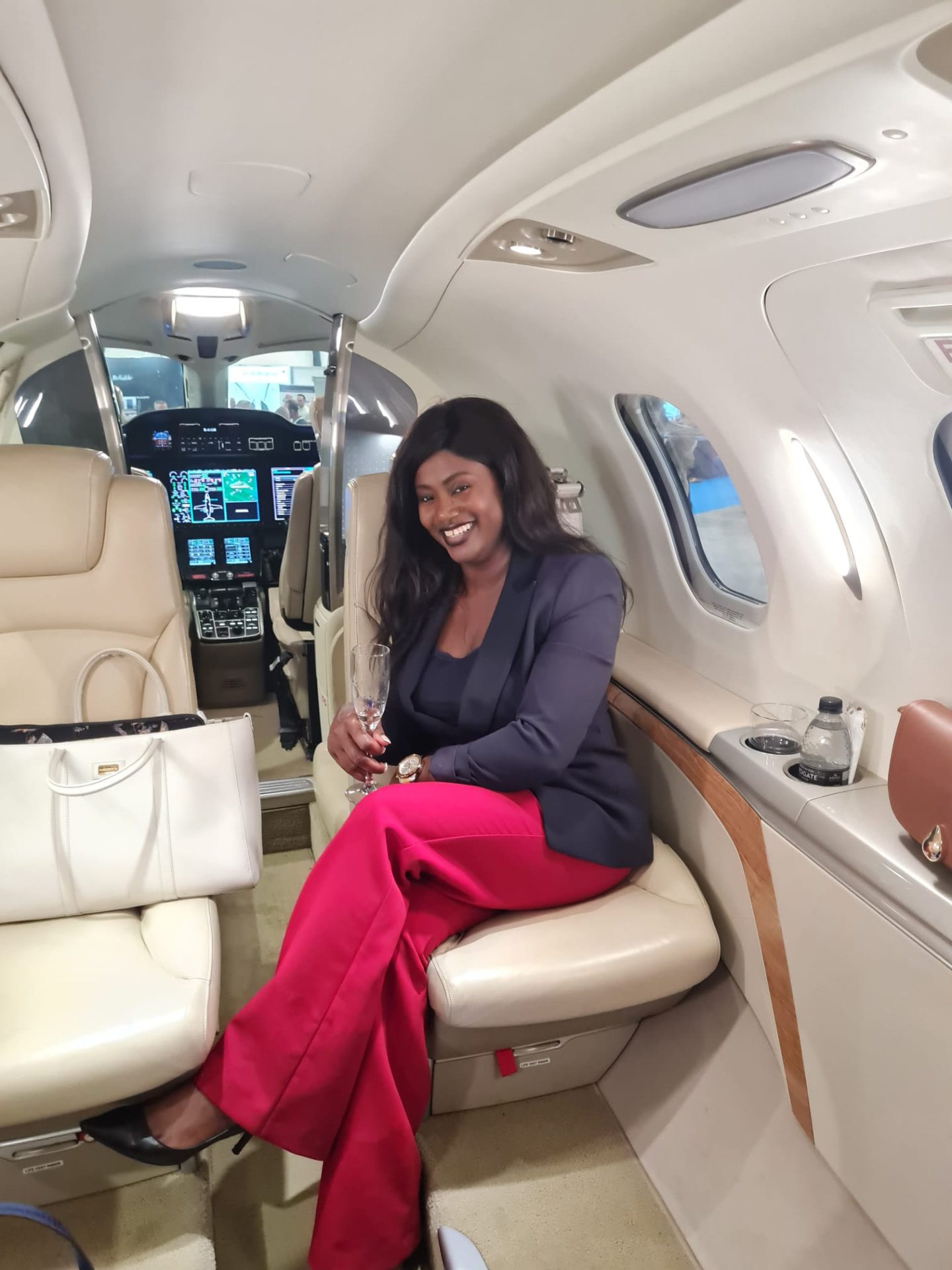 Kemi Areola aboard a private aircraft