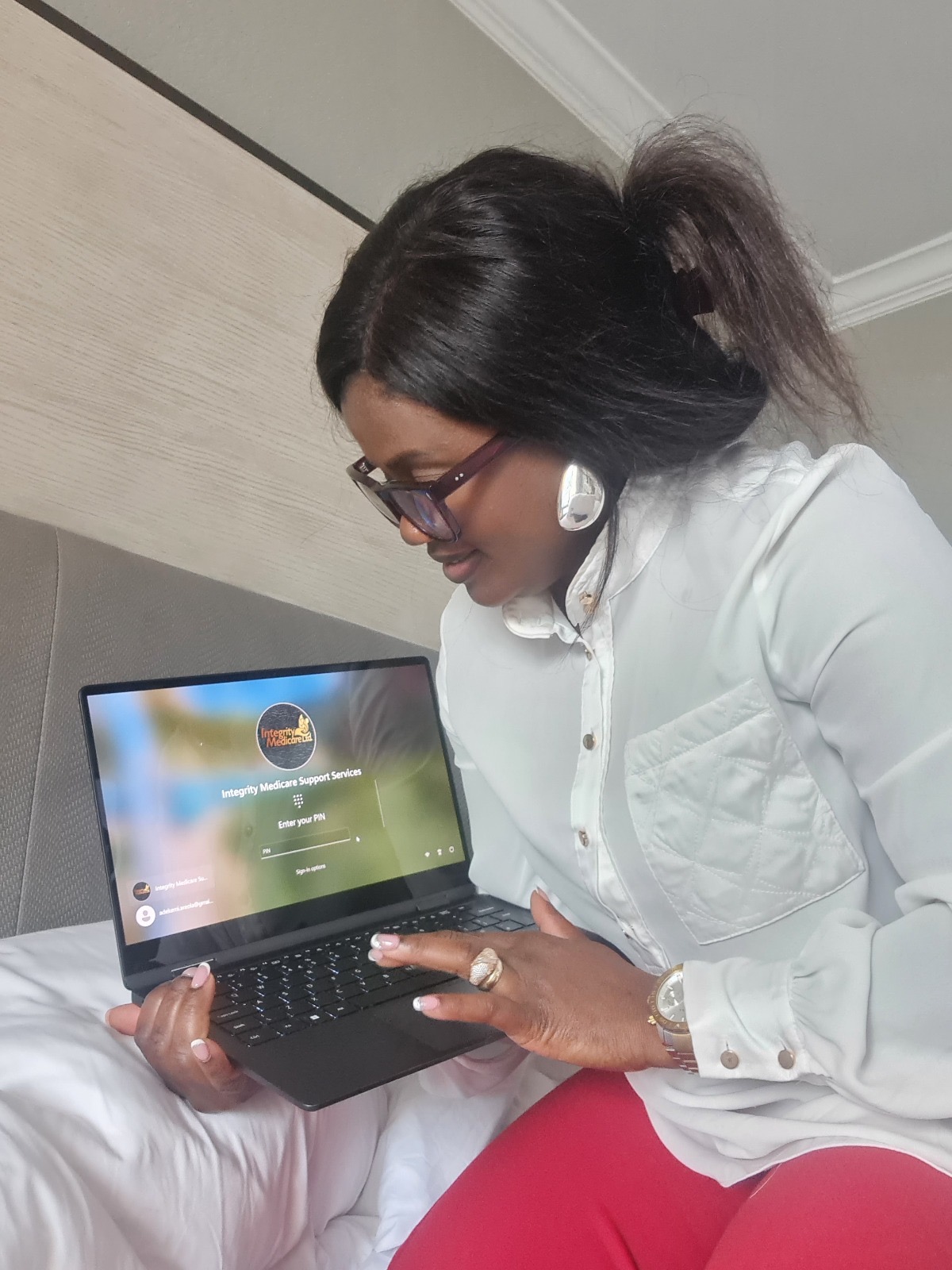 Kemi Areola working on a laptop